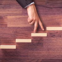 Personal development, personal and career growth, progress, self improvement and potential concepts. Metaphor of coach (human resources officer, manager, mentor) motivate employee to growth.